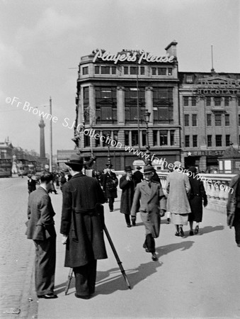 PEDESTRIANS IN O'CONNELL BRIDGE  'PLAYERS PLEASE'